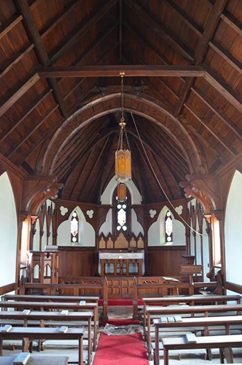 A church with a wooden ceiling

Description automatically generated with medium confidence